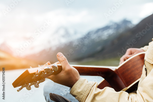 the guy plays the guitar in mountains