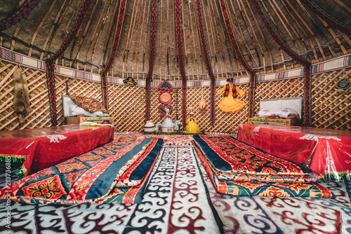 National traditional decoration of the yurt ceiling. Kazakhstani ornament. Vintage weaving of patterns. Yurt decoration. Wooden frame with patterns as an ethnic background, golden horde, Kazakhstan. photo