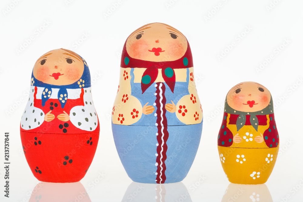Fototapeta premium Three Russian dolls babushka matryoshka isolated on white background