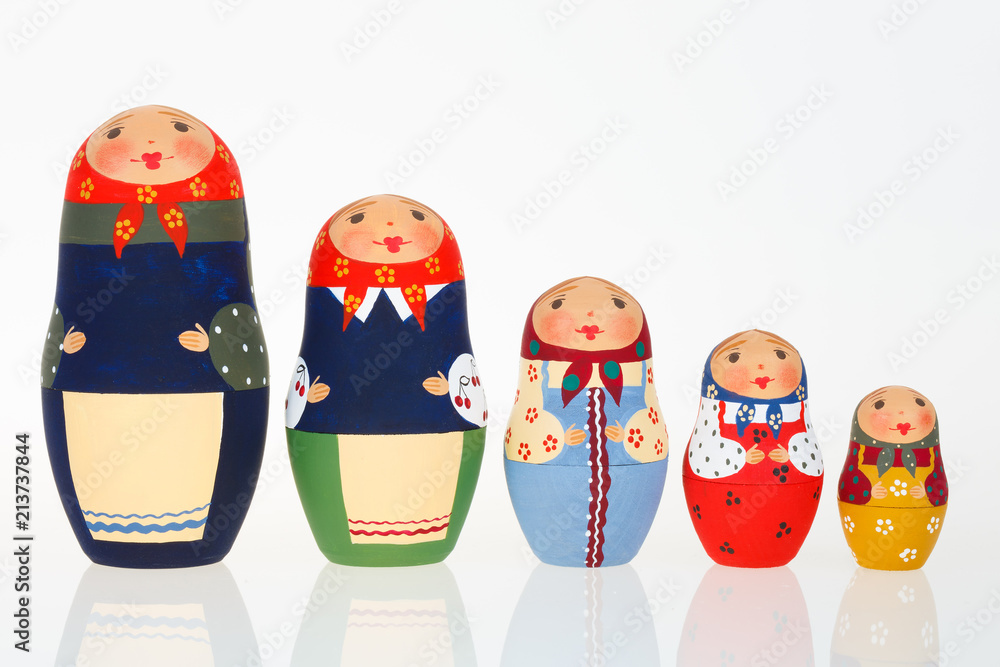Set of Russian dolls babushka matryoshka lined up isolated on white Set of Russian dolls babushka matryoshka lined up isolated on white