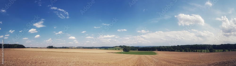 scenic panorama view of natural landscape under a cloudy sky 
