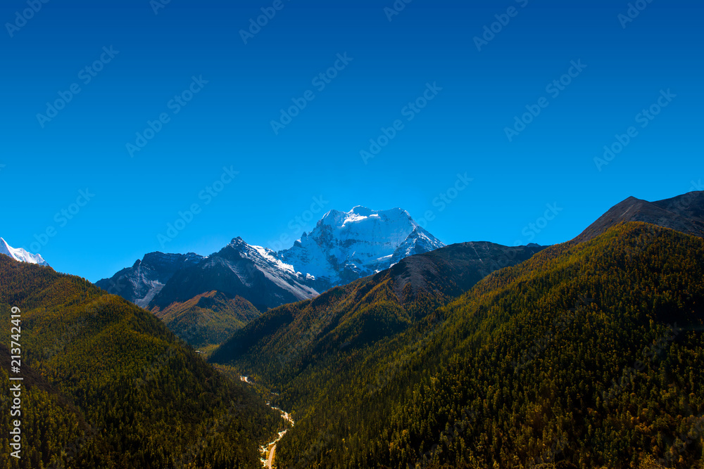 Beautiful mountain view with blue sky at Yading national reserve at Daocheng County, in the southwest of Sichuan Province, China.