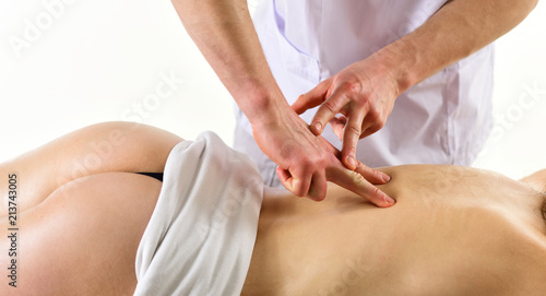 reflexotherapy. man do reflexotherapy for woman. reflexotherapy massage at spa salon. woman at reflexotherapy massage made by man with hands. Beautiful body photo