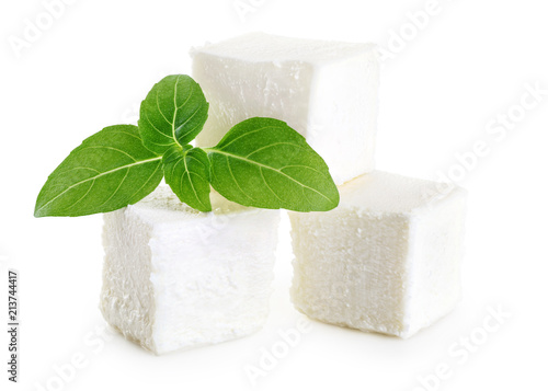 Feta cheese and basil isolated on white background.