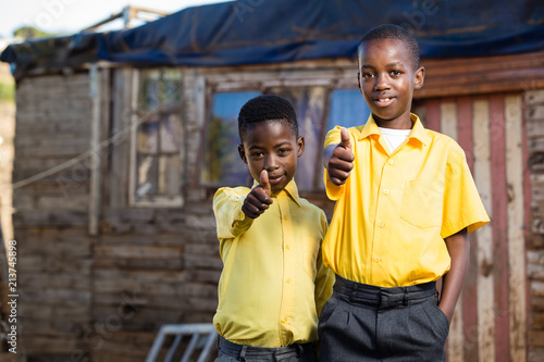 Black boys showing thumbs up