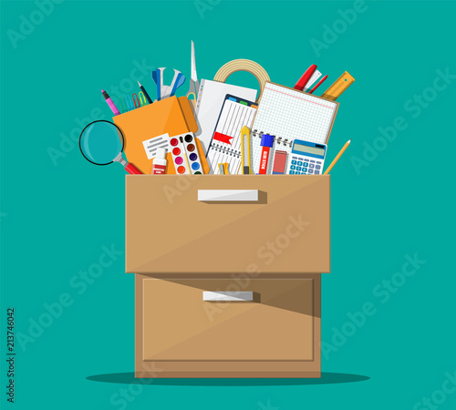 Office accessories in wooden drawer.