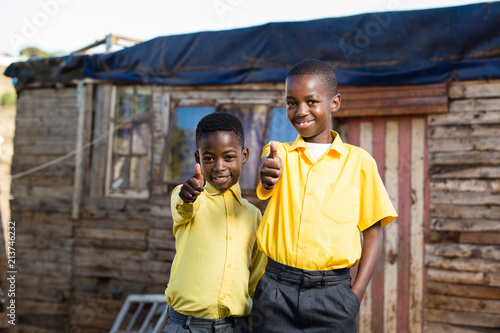 Happy boys with their thumbs up.