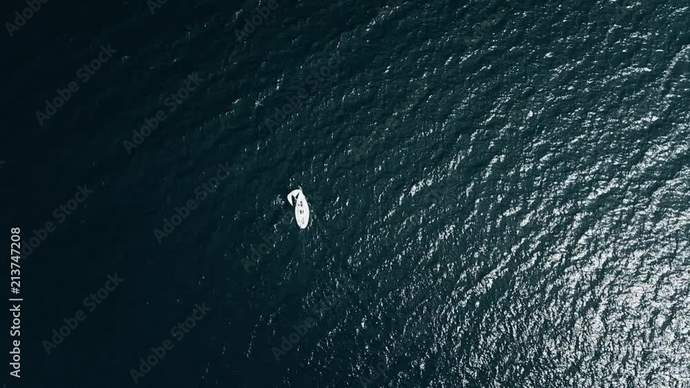 Sailboat on opened sea on aerial view Sailboat on opened sea on aerial view