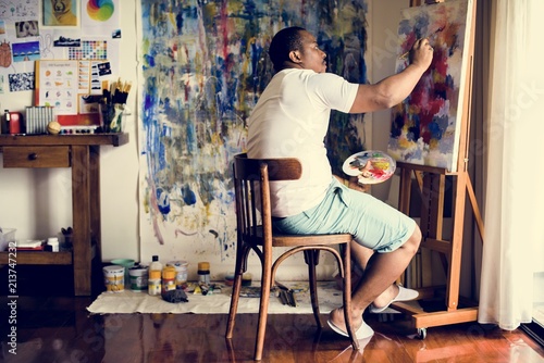 Black artist man doing artwork