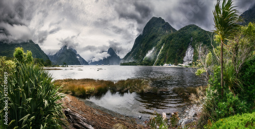 Wild Weather at Milford Sound -Panoramic view at Freshwater Basin towards the fjord's entry, with Bowen falls and Mitre Peak in Fiordland National Park, New Zealand photo