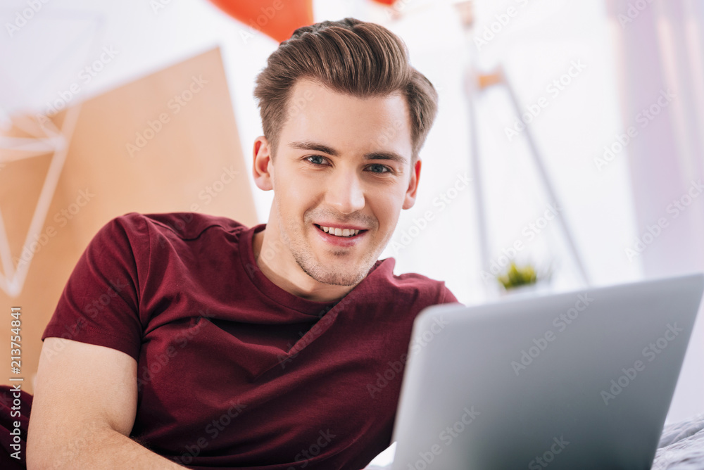 Cheerful smile. Joyful brunette male keeping smile on face while having rest Cheerful smile. Joyful brunette male keeping smile on face while having rest
