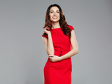 Beautiful woman in a red dress. Fashionable business woman.