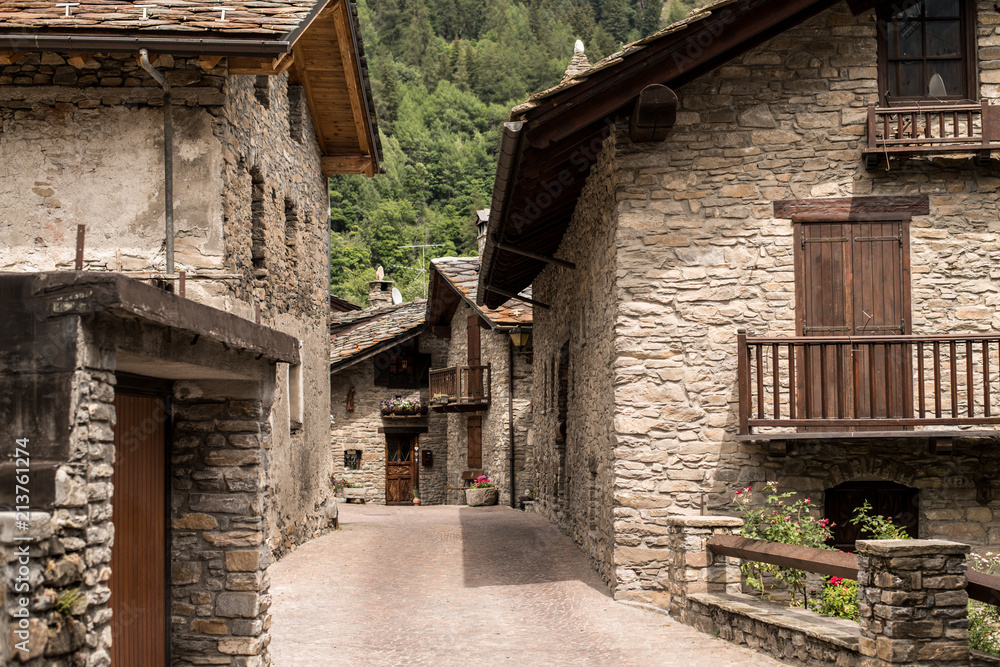 Typical stone house buildings in an italian alpine village near Courmayeur, The Alps, Italy.