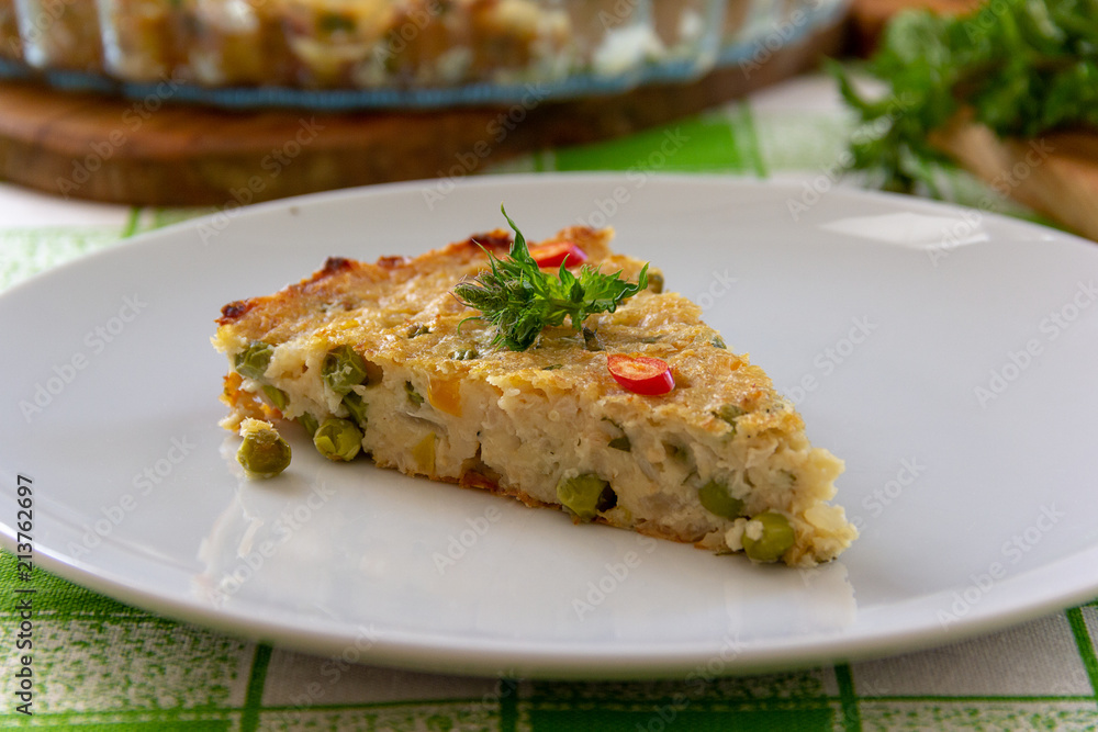 piece of vegetable pie with green peas piece of vegetable pie with green peas