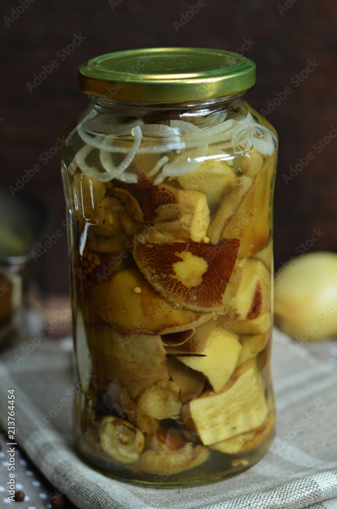 Marinated mushrooms in a glass jar Marinated mushrooms in a glass jar