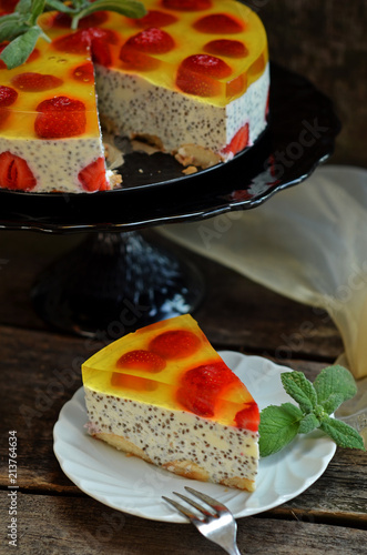 Cuadro en lienzo A slice of cold cheesecake with chia and strawberries on a white plate