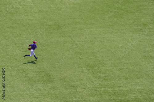 Canvas Print American youth baseball player running on field