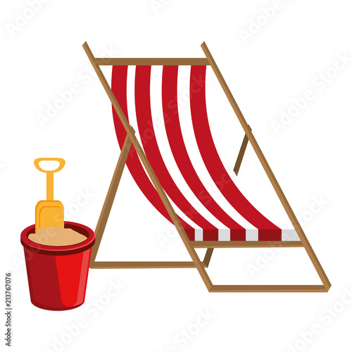 wooden beach chair and sand bucket