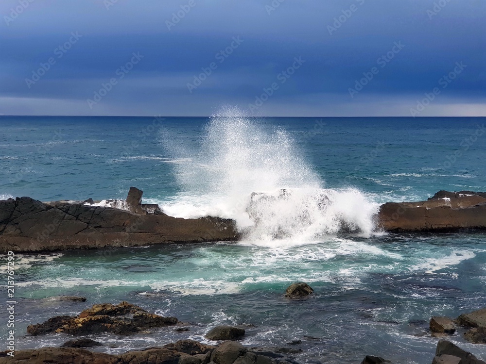 Australian Coastline wave crashing into rocks Australian Coastline wave crashing into rocks