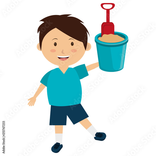 little boy with sand bucket