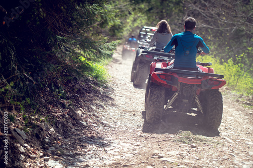 man riding atv vehicle on off road track ,people outdoor sport activitiies theme photo