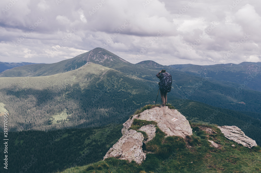 Woman standing on Carpathian Mountains overlooking the Goverla view