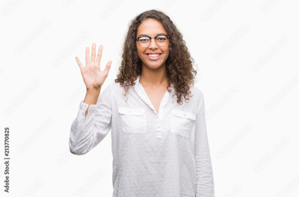 Beautiful young hispanic woman showing and pointing up with fingers number five while smiling confident and happy. Beautiful young hispanic woman showing and pointing up with fingers number five while smiling confident and happy.