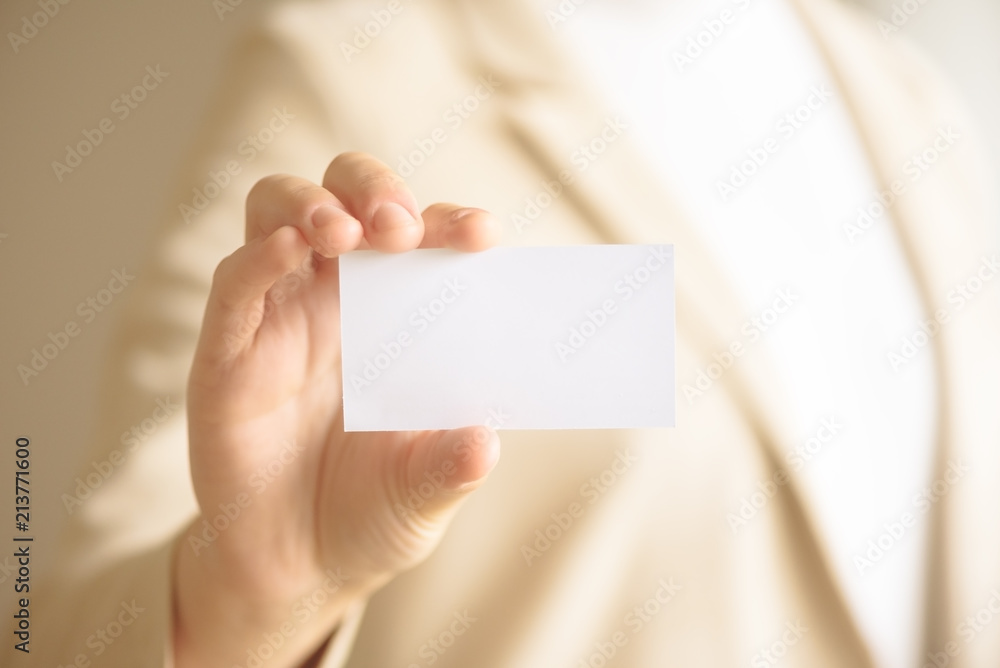 Businessman holding empty business card with copy space. Mock up. Business, study, network concept. Businessman holding empty business card with copy space. Mock up. Business, study, network concept.