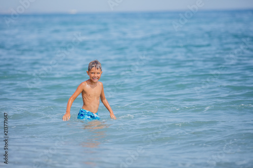 Happy child on beach. Summer vacation concept