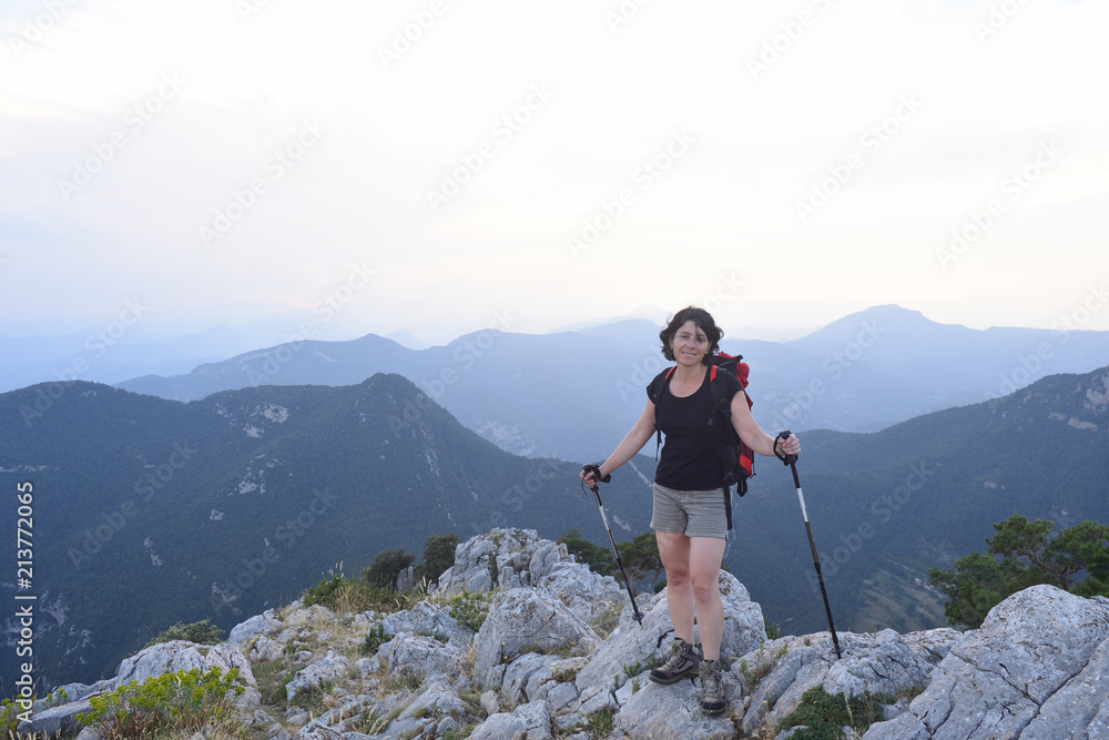 portrait of a female hiker who has reached the top