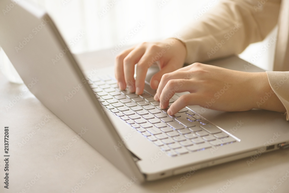 Close-up of hands typing on laptop keyboard at the office. Copy space. Worker, business, remote work, always connect, online banking concept. Soft focus Close-up of hands typing on laptop keyboard at the office. Copy space. Worker, business, remote work, always connect, online banking concept. Soft focus