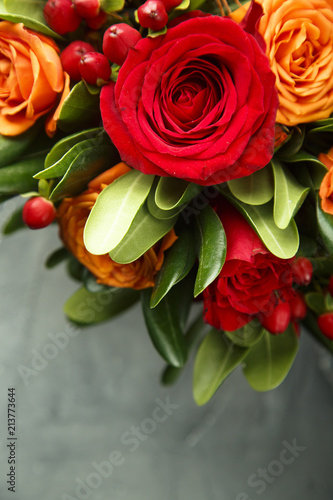 Winter or autumn bouquet with roses