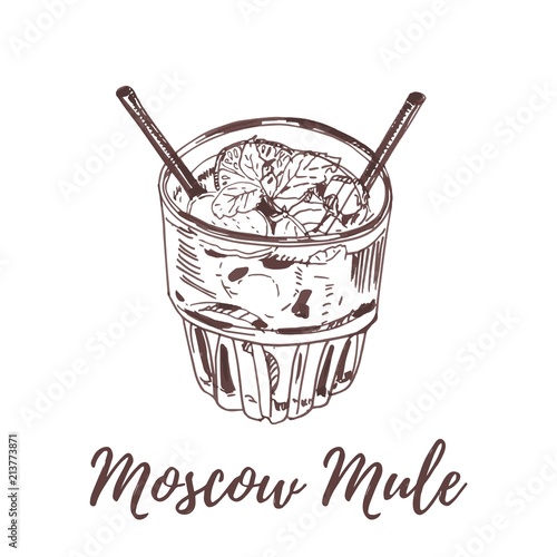 moscow mule cocktail in old fashioned glass garnished with lime and mint leaves