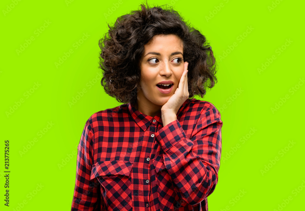 Beautiful arab woman so happy and confident showing a big smile surprised finger Beautiful arab woman so happy and confident showing a big smile surprised finger