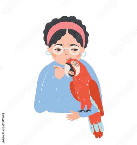 Portrait of woman in glasses holding her macaw parrot and feeding it