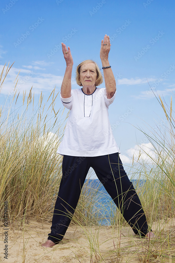 An old woman practicing Tai Chi