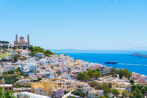 Panoramic view of Ermoupoli city of Syros Island in Cyclades, Greece. Top view of the colorful houses, the port and the Orthodox Anastaseos church photo