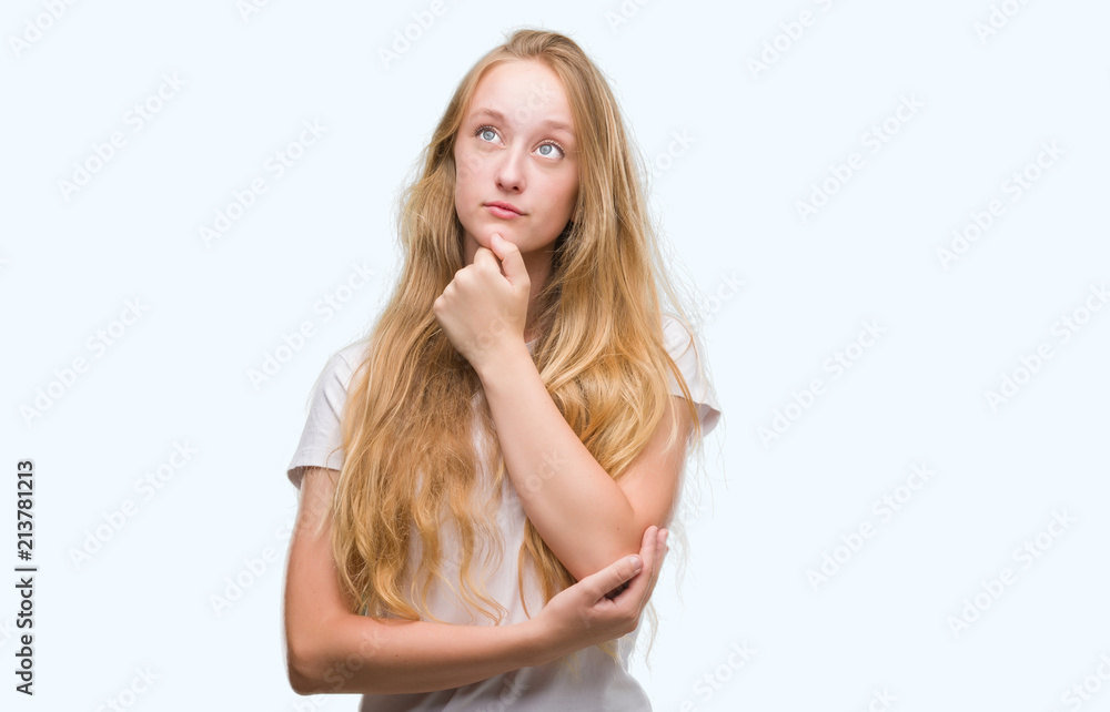 Blonde teenager woman serious face thinking about question, very confused idea Blonde teenager woman serious face thinking about question, very confused idea