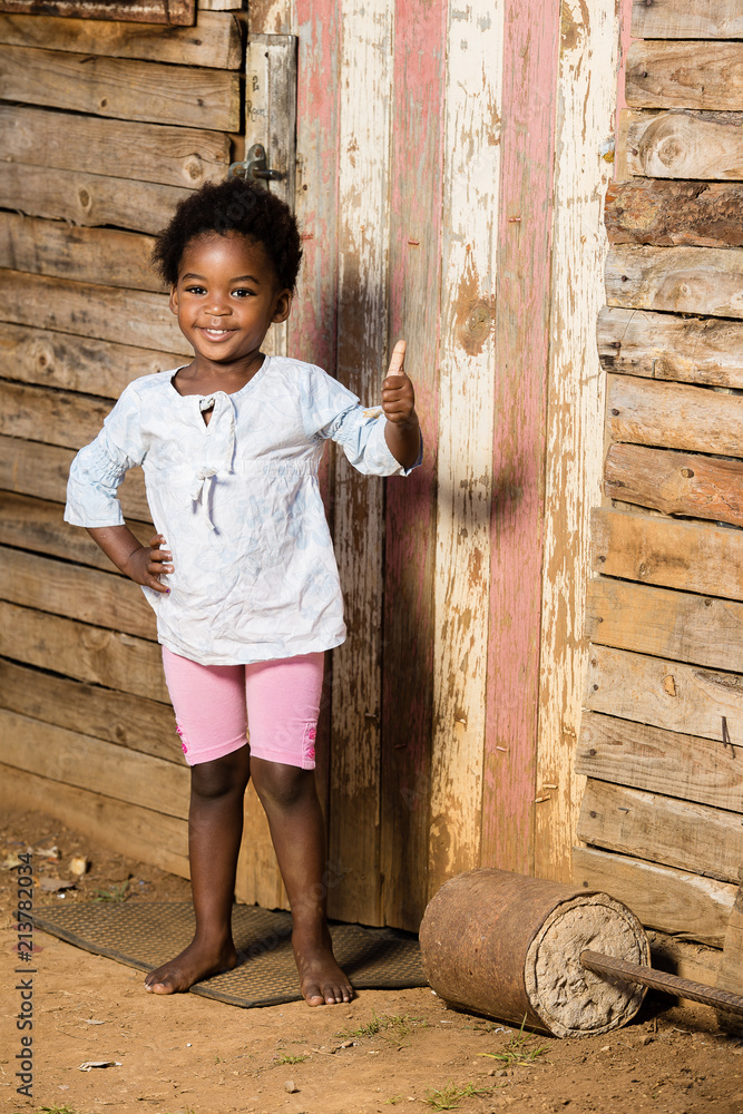 Black little girl showing a thumbs up Black little girl showing a thumbs up