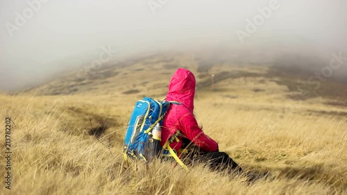 Hiker woman enjoying the view in nature. photo