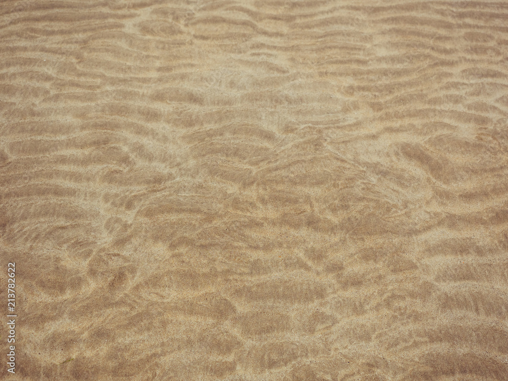 Obraz premium abstract pattern made by tide on sandy beach