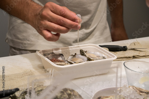 the chef prepares oysters