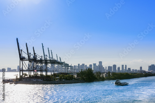 Industrial port in Miami, shipyard, cargo cranes and containers