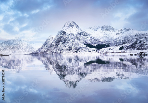 Mountain ridge and reflection at the water. Beautiful natural landscape in the Norway © biletskiyevgeniy.com