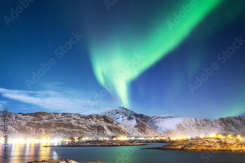 Northen light above mountains and ocean. Beautiful natural landscape in the Norway photo