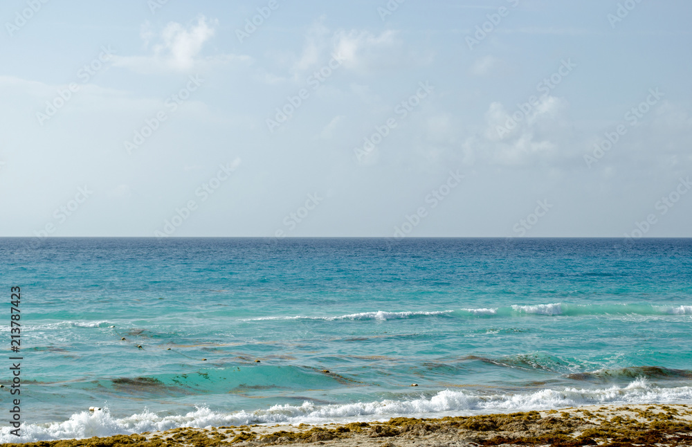 Caribbean Sea beach with sky horizon and water. Wave, cloud