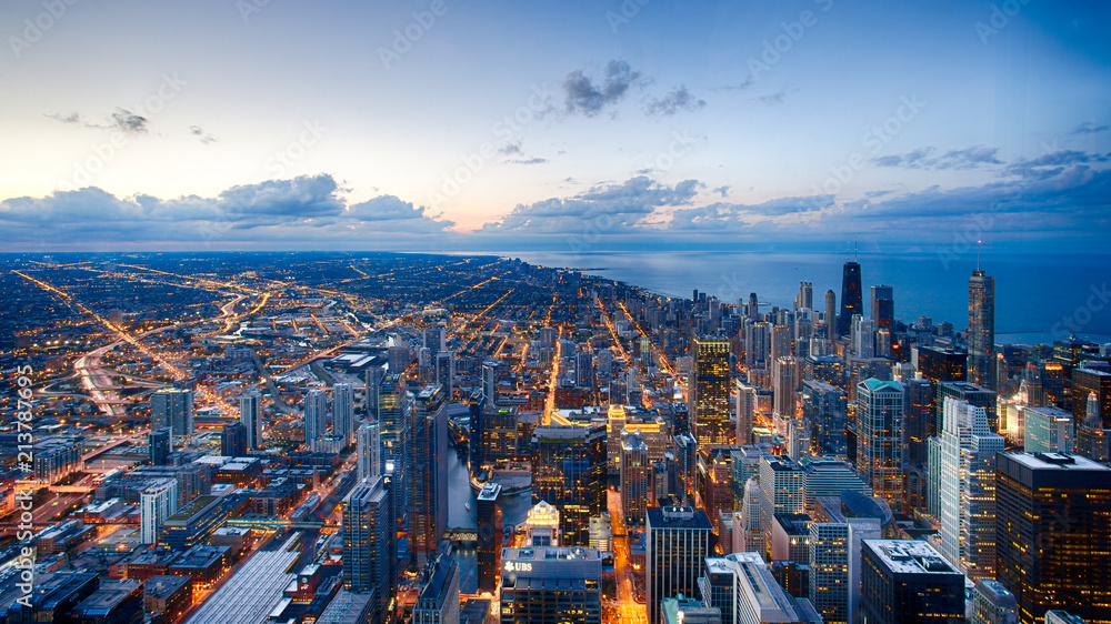 Fototapeta premium A look at the Chicago skyline near sunset from the Willis Tower Skydeck in Chicago, Illinois