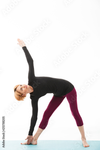 Portrait of a healthy yoga woman dressed in sport clothes