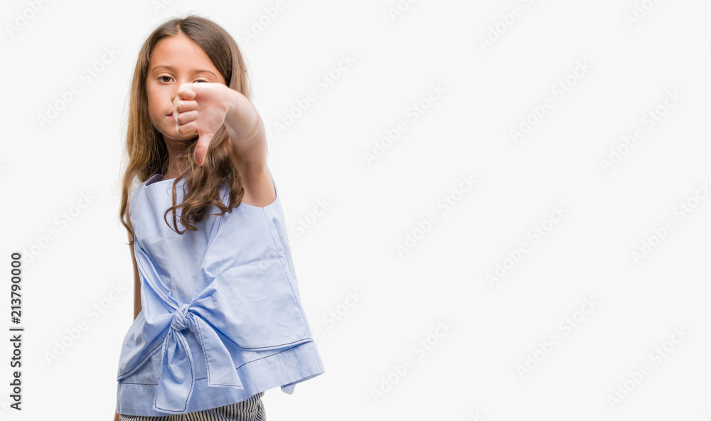 Brunette hispanic girl looking unhappy and angry showing rejection and negative with thumbs down gesture. Bad expression. Brunette hispanic girl looking unhappy and angry showing rejection and negative with thumbs down gesture. Bad expression.