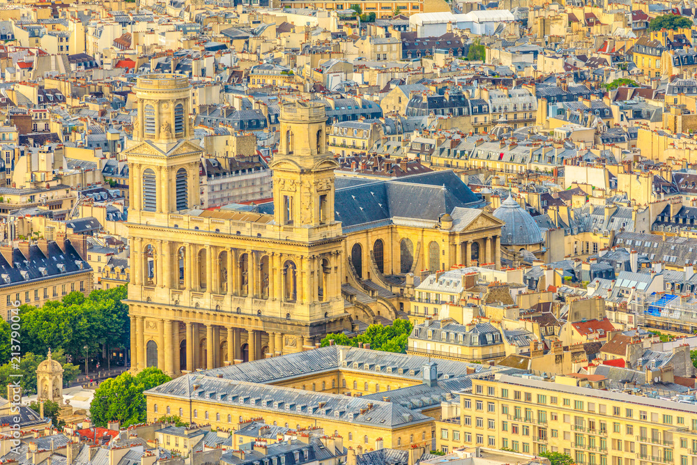 Closeup of Saint-Sulpice Church or Eglise Saint-Sulpice at sunset light from panoramic terrace of Tour Montparnasse. Aerial view of Paris urban skyline, Capital of France in Europe.